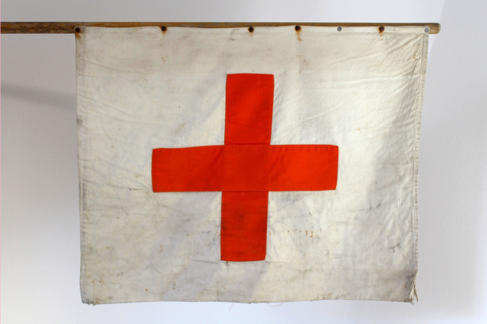 A flag with a red cross